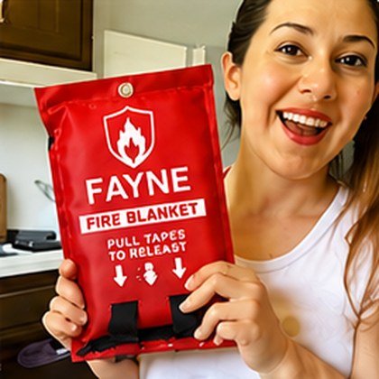 Fayne customer holding their fire blanket at home